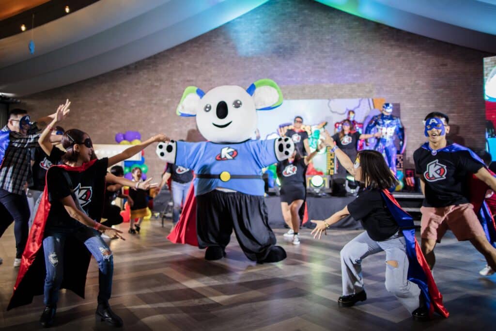 kody mascot dancing with staff